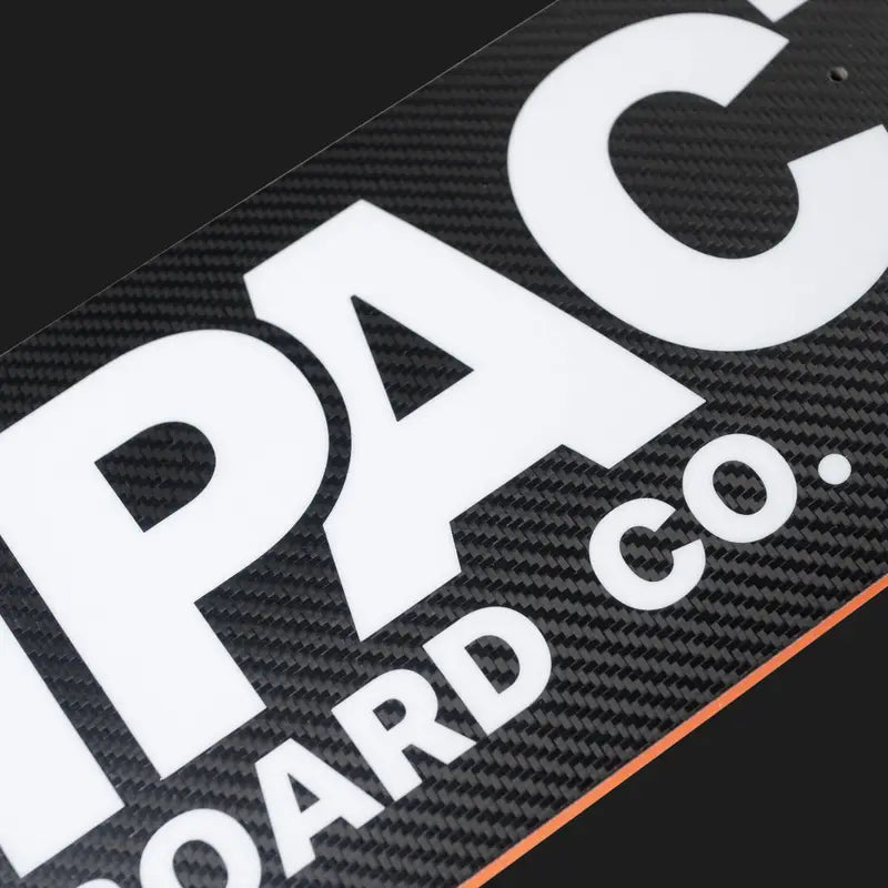 Close-up of a carbon fiber surface with 'IPAC BOARD CO.' branding.