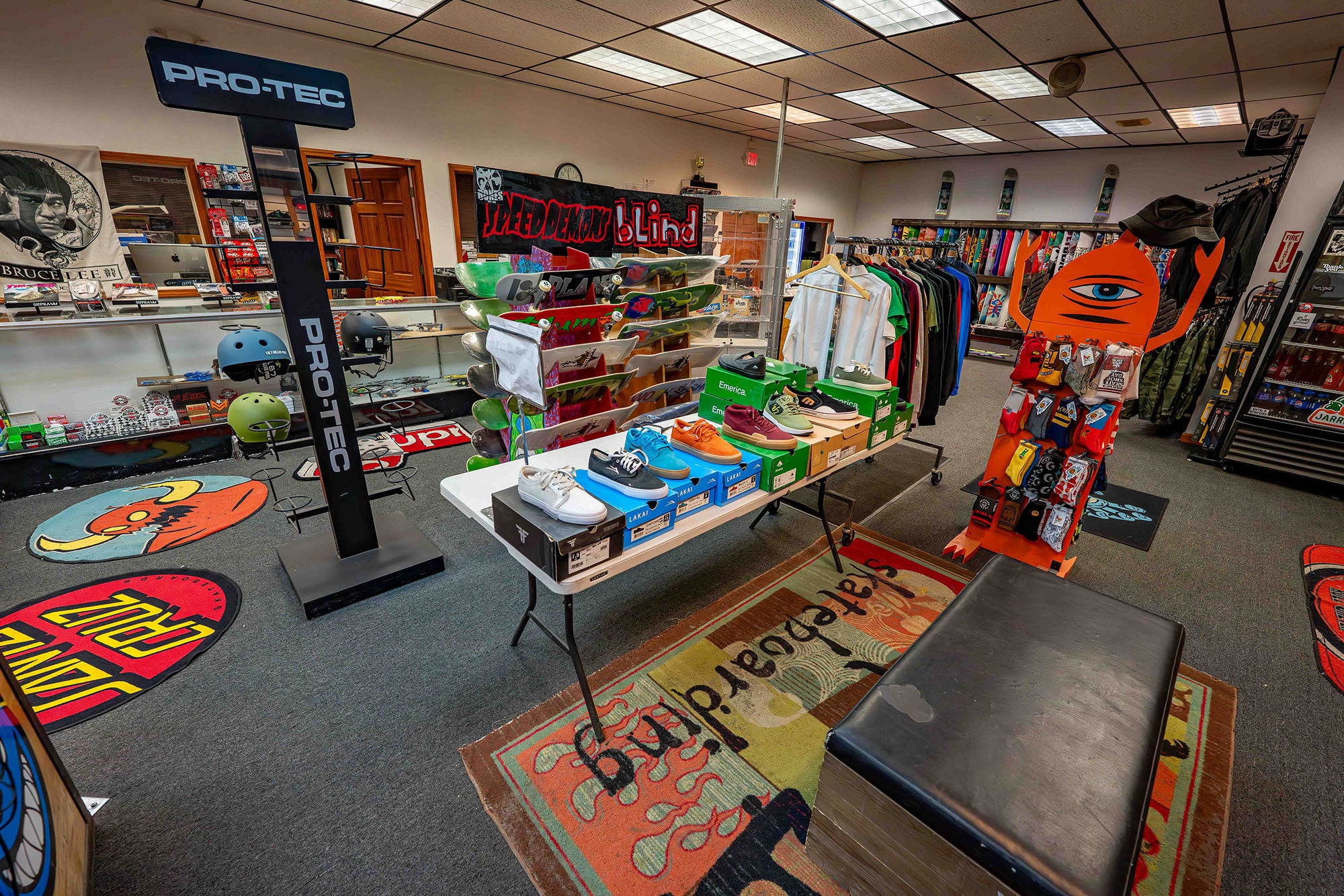 Indoor skate shop with various skateboards and equipment on display.