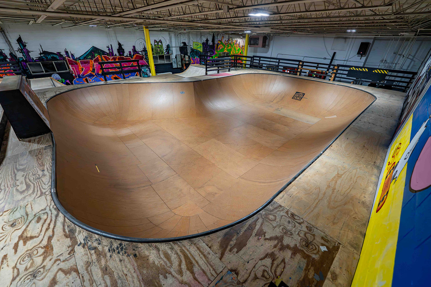 Indoor skateboard park near Chicago with street course and bowl at Asylum Skatepark
