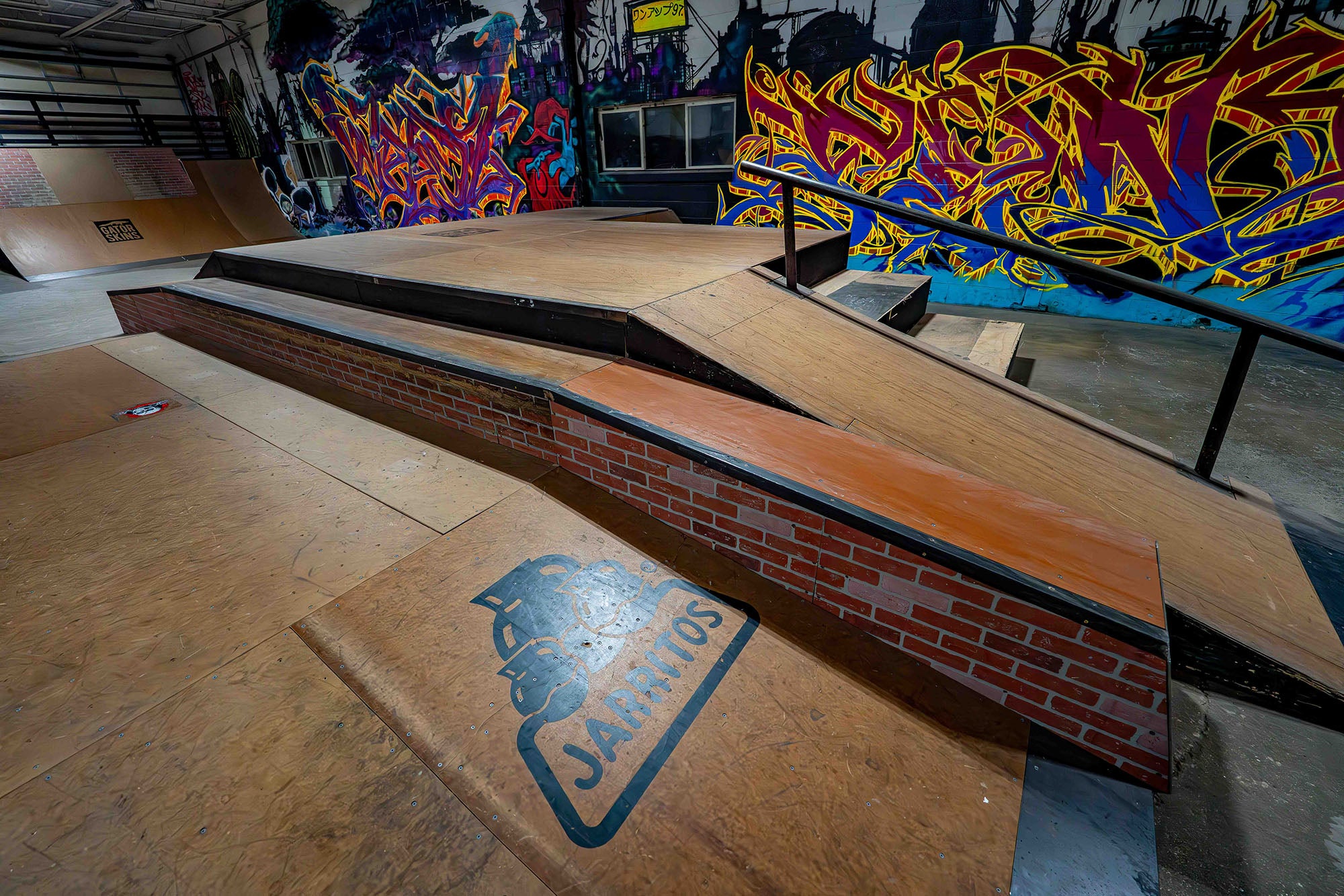 Skateboard ramp with graffiti art in an indoor skate park